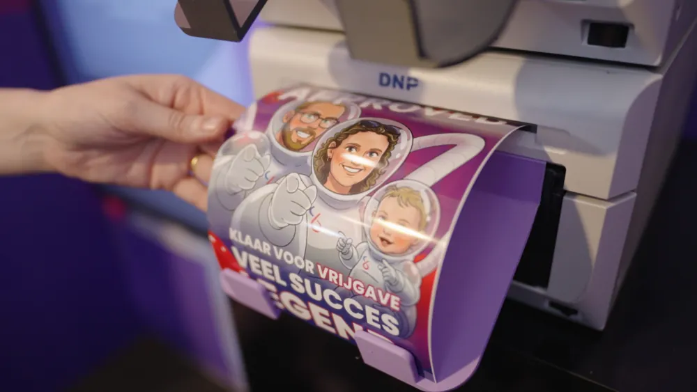 A celfie printing from the DNP printer on the booth